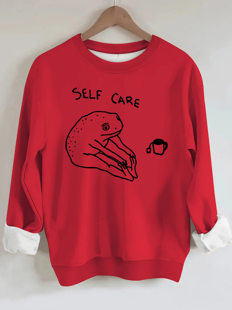 Békamintás női pulóver „Self Care” felirattal