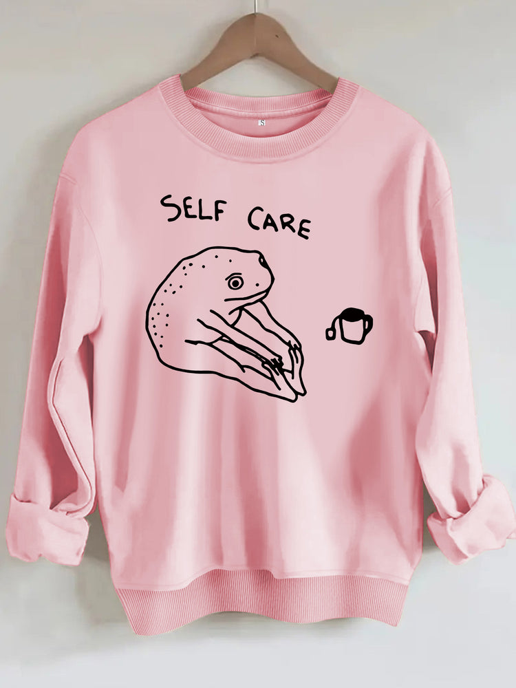 Békamintás női pulóver „Self Care” felirattal