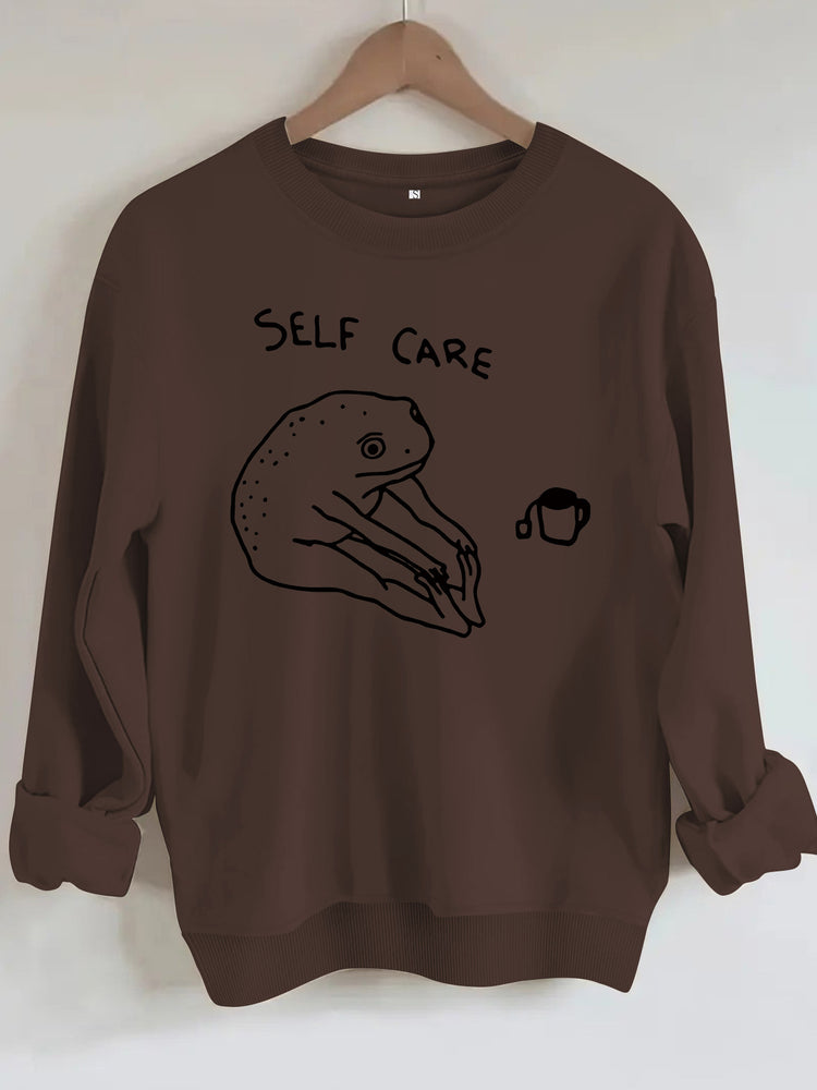 Békamintás női pulóver „Self Care” felirattal