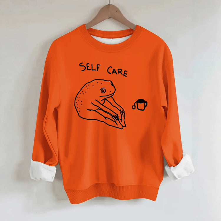 Békamintás női pulóver „Self Care” felirattal