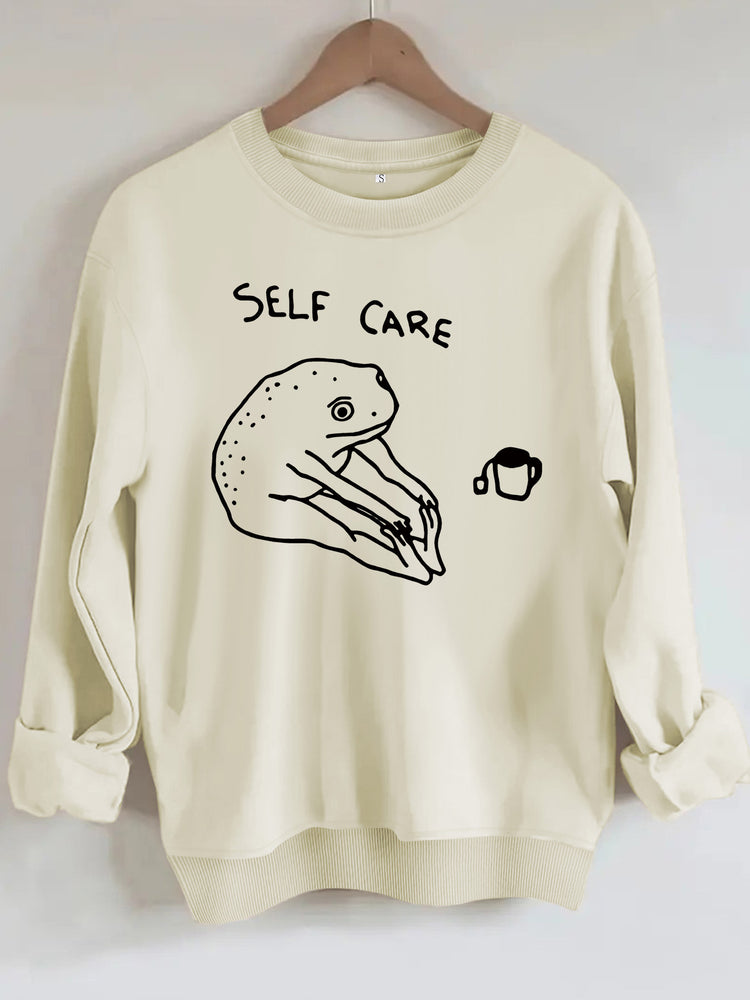 Békamintás női pulóver „Self Care” felirattal