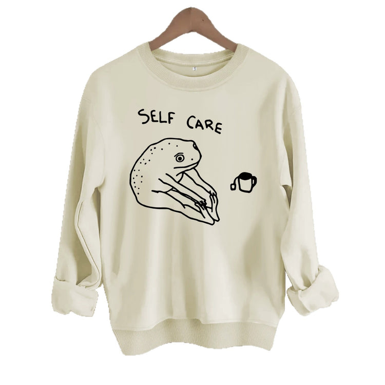 Békamintás női pulóver „Self Care” felirattal