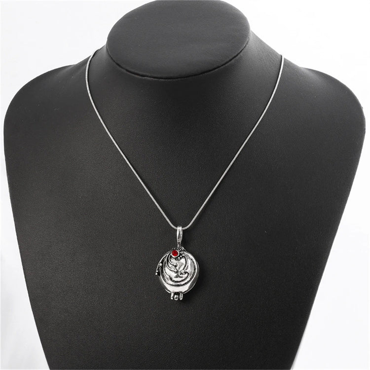 Antique silver-tone women's necklace with an ornate pendant