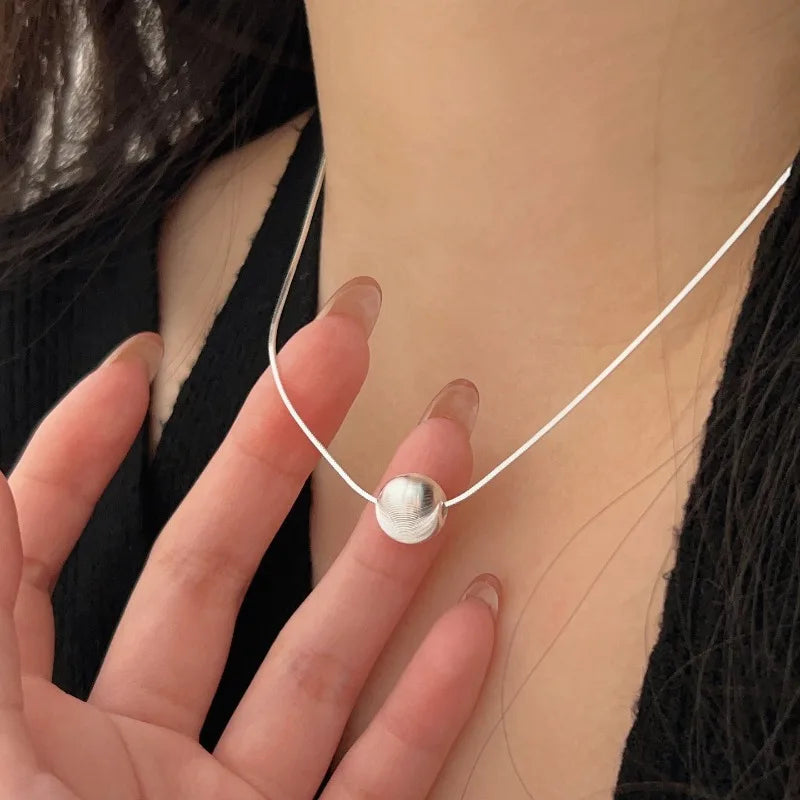 Women's silver necklace with a zirconia pendant