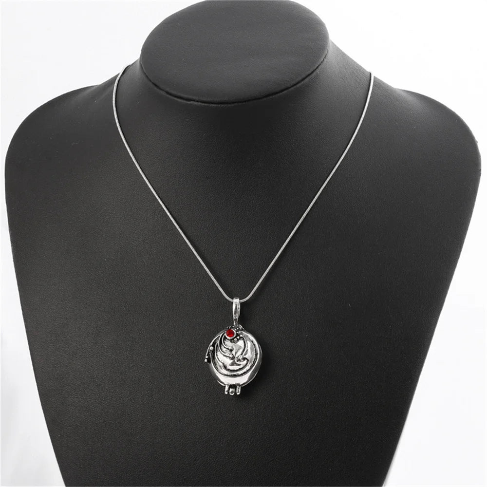 Antique silver-tone women's necklace with an ornate pendant